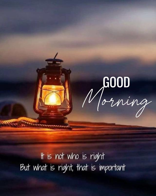 a lit lantern sitting on top of a wooden dock next to the ocean at night Good morning 640 800 a lit lantern sitting on top of a wooden dock next to the ocean at night Good morning 640 800